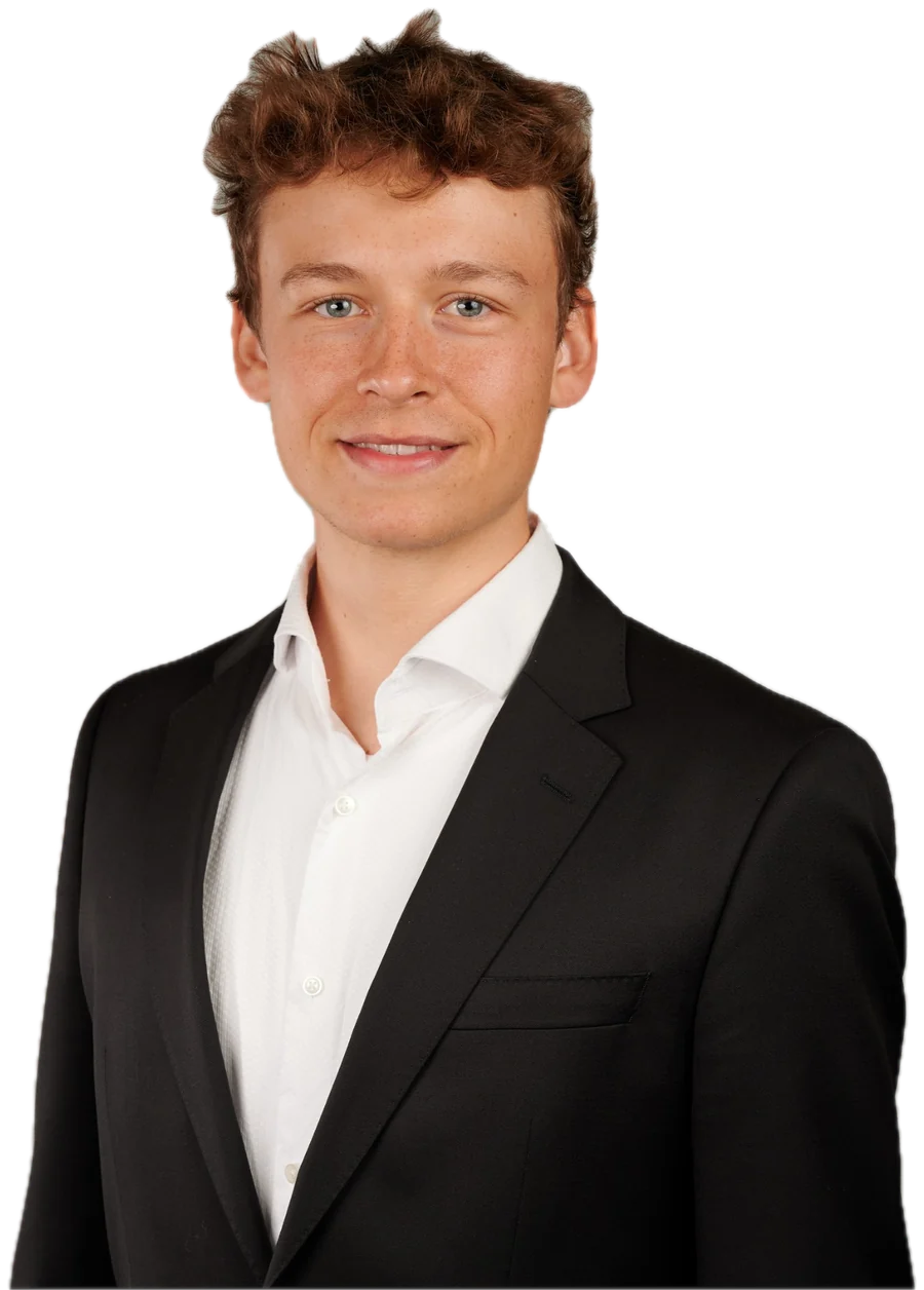 Milan Zwiauer, founder of Sprout Ventures, in a dark suit and white shirt, smiling.